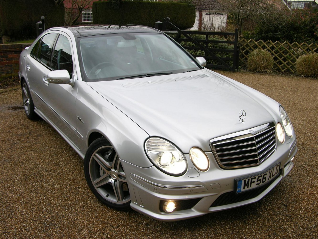 Silver sedan with quad headlights and AMG alloy wheels