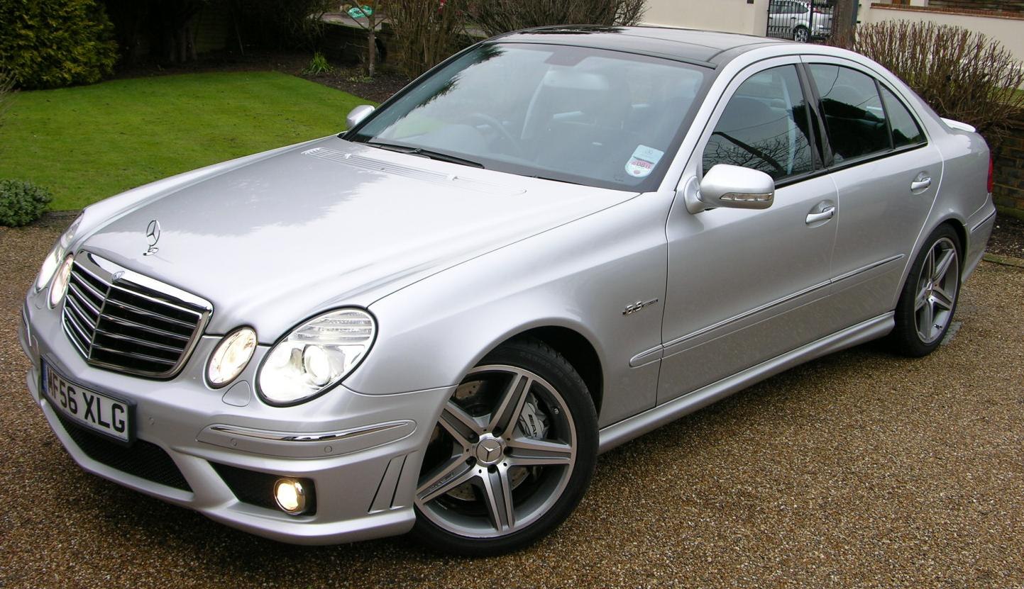 Silver sedan with distinctive twin headlights and AMG wheels