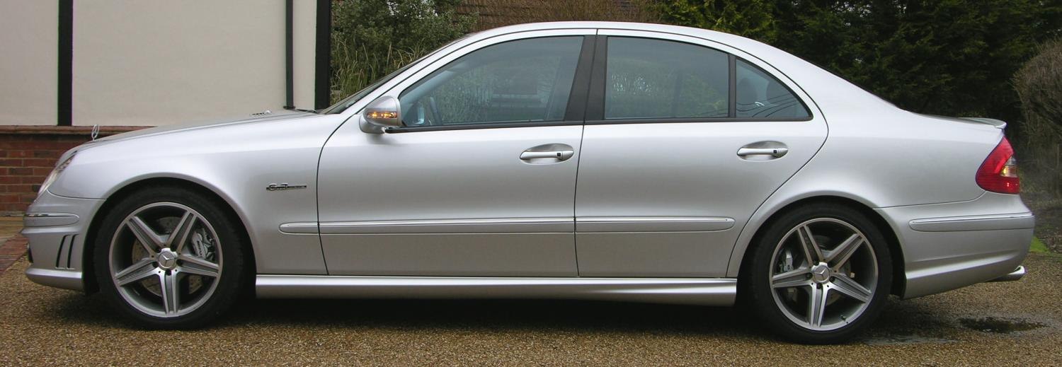 Side profile of a silver luxury sedan with AMG alloy wheels