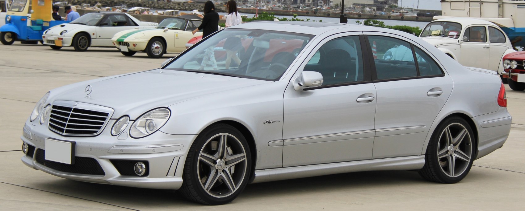 Silver sporty sedan with AMG styling and multi-spoke rims