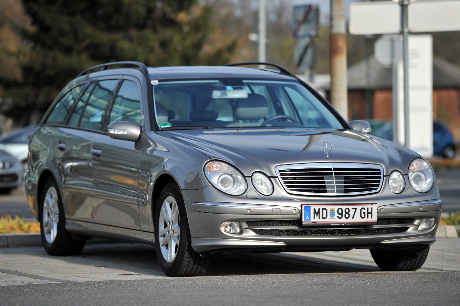 Front view of silver station wagon with iconic headlights and grille