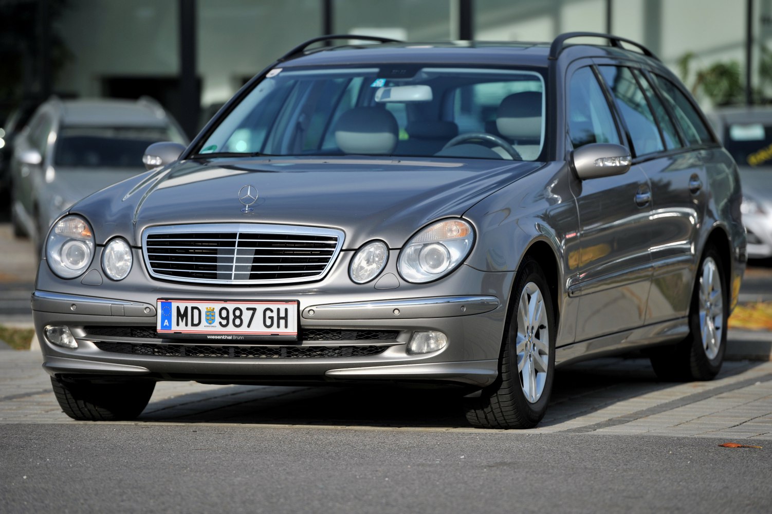 Front view of a vehicle with distinctive grille and dual round headlights.