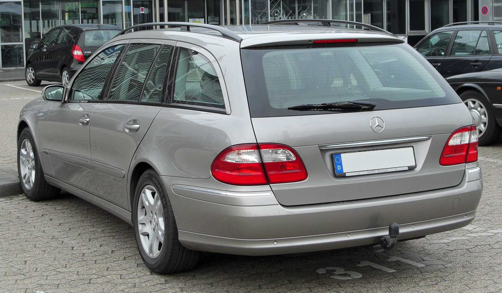 Rear view of estate car with roof rails and distinctive tail lights