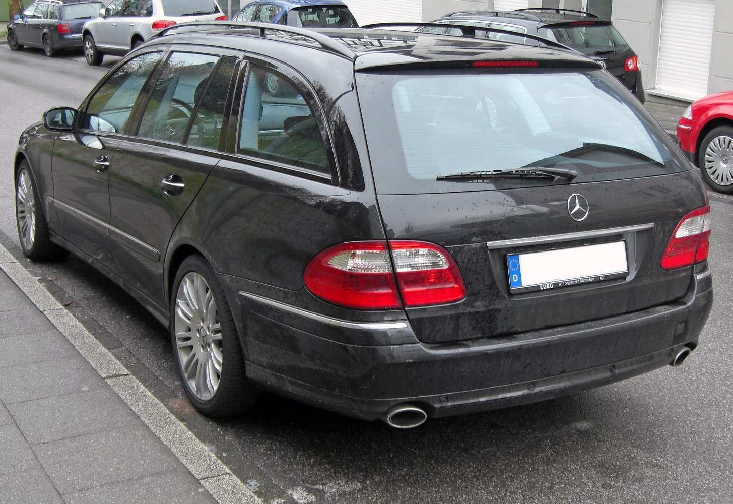 Rear station wagon with taillights and dual exhaust pipes