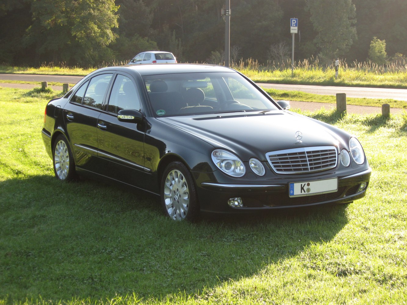 Front side view of sedan with quad rounded headlights