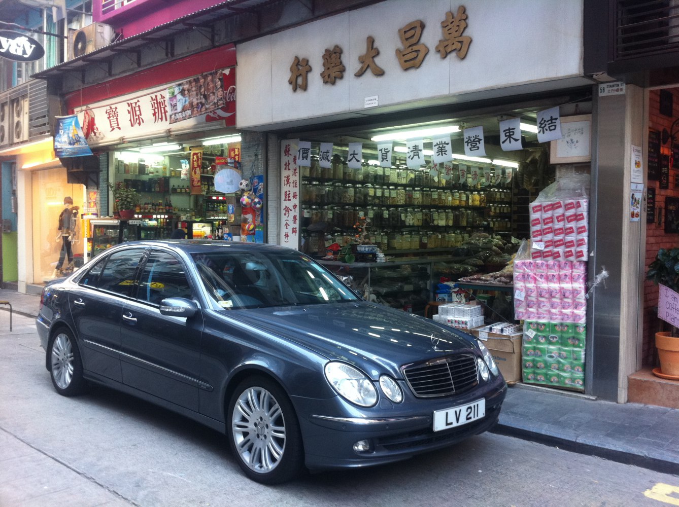 Front and side view of luxury sedan with distinctive grille and headlights