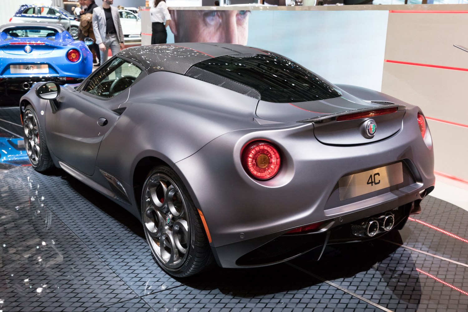 Rear view of sports coupe with round LED taillights and carbon fiber roof panel