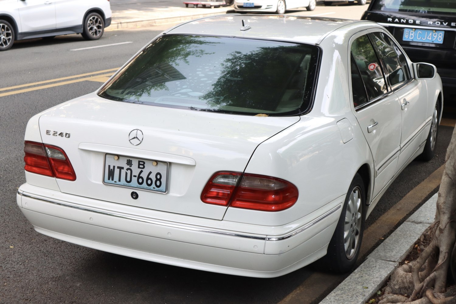 Rear view with classic tail lights and trunk of a 1999 luxury sedan