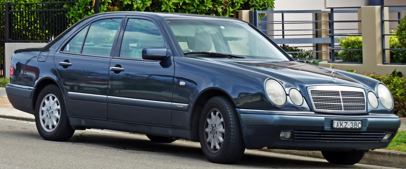 Mercedes sedan with quad circular headlights and sleek side profile