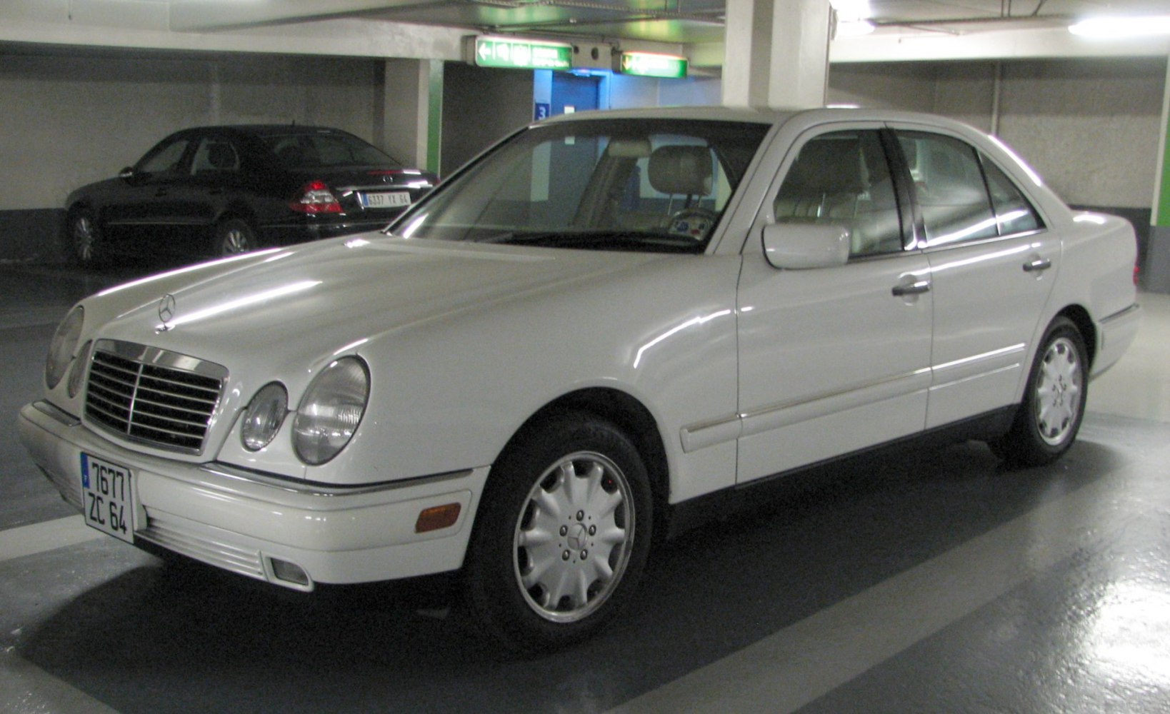 Sedan with oval headlights and chrome grille in parking garage