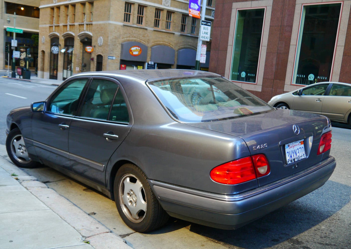 Rear and side exterior view with tail lights and alloy wheels