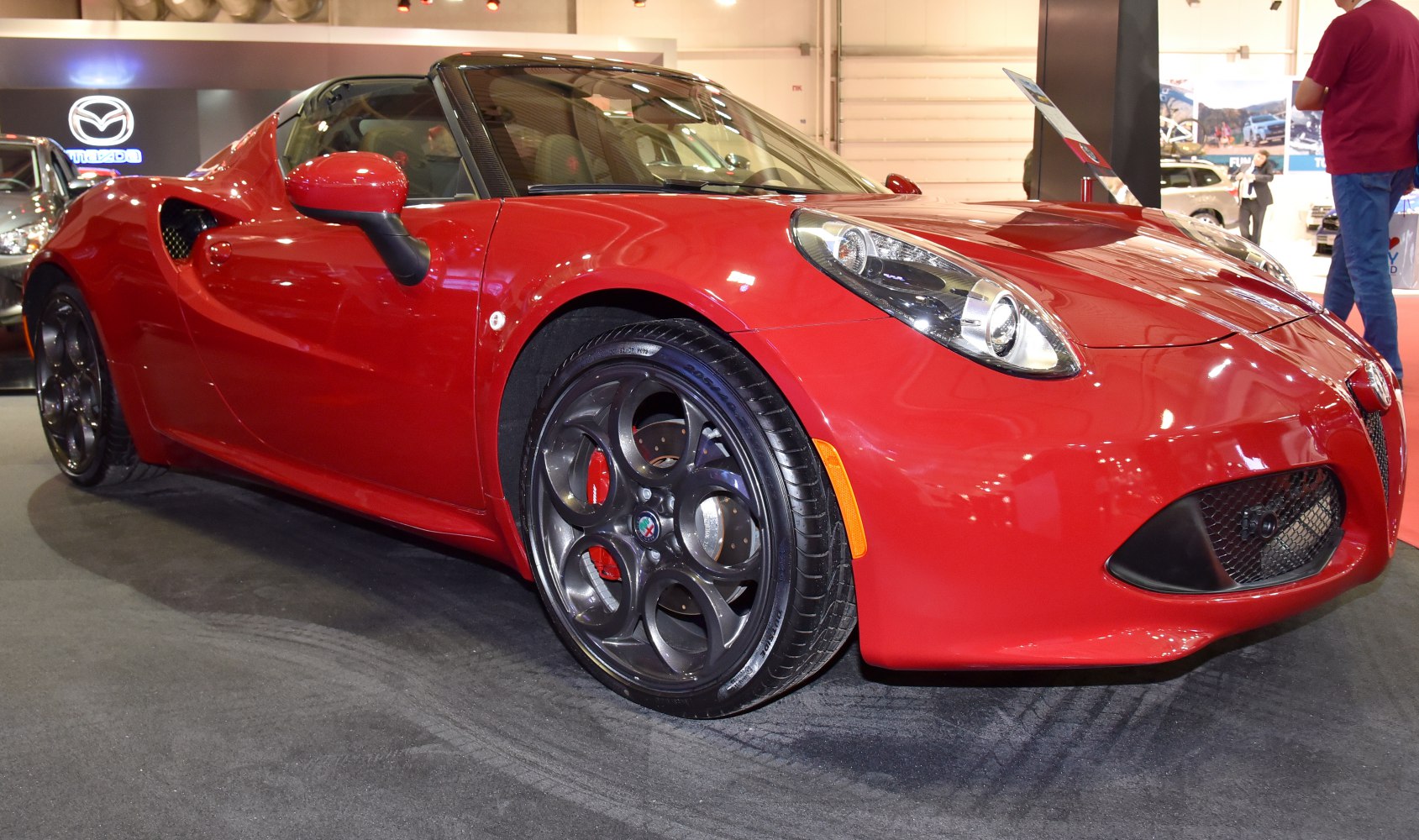 Front-side view of sporty convertible with distinctive circular alloy wheels