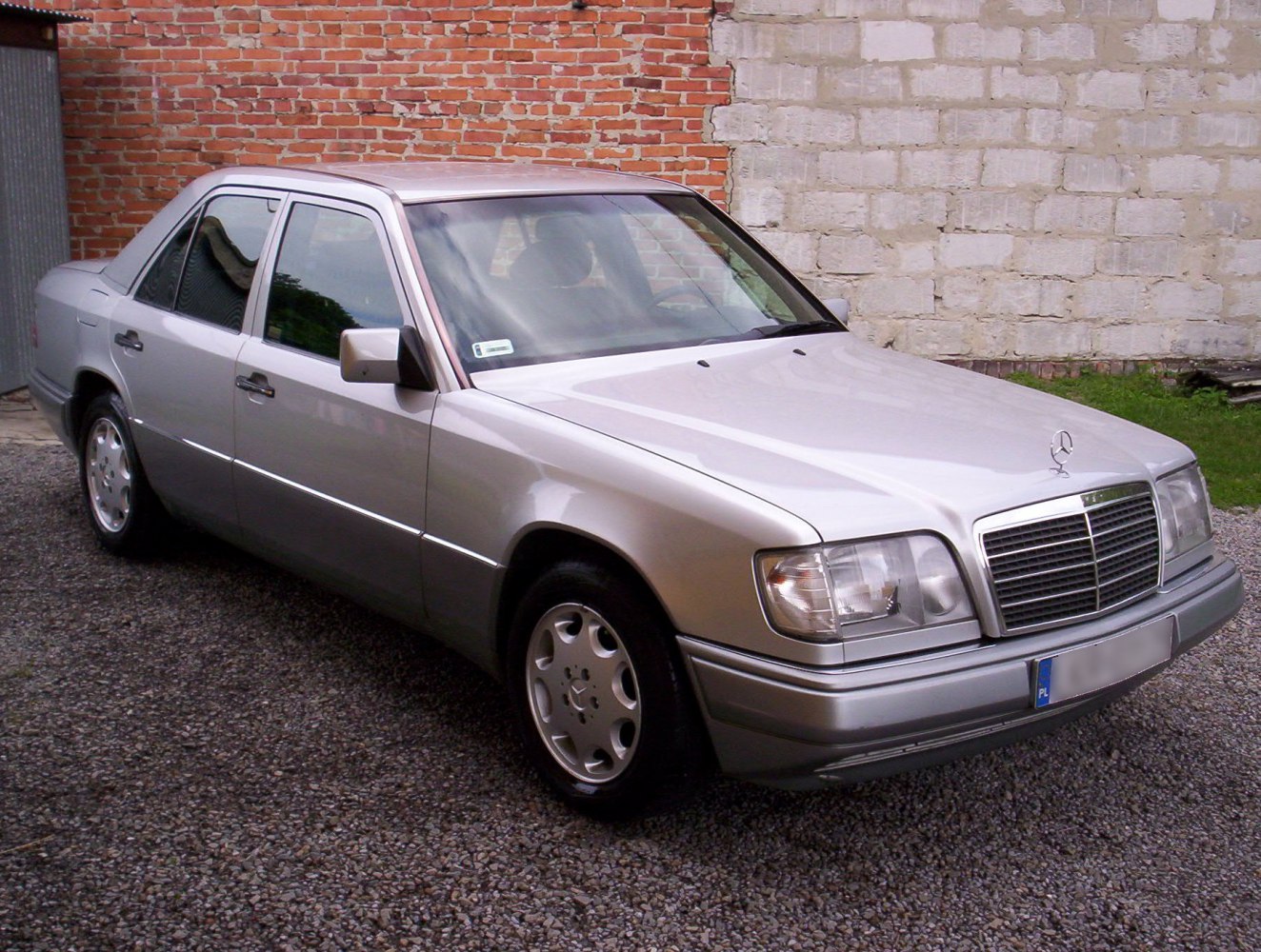 Silver sedan with classic front grille and alloy wheels