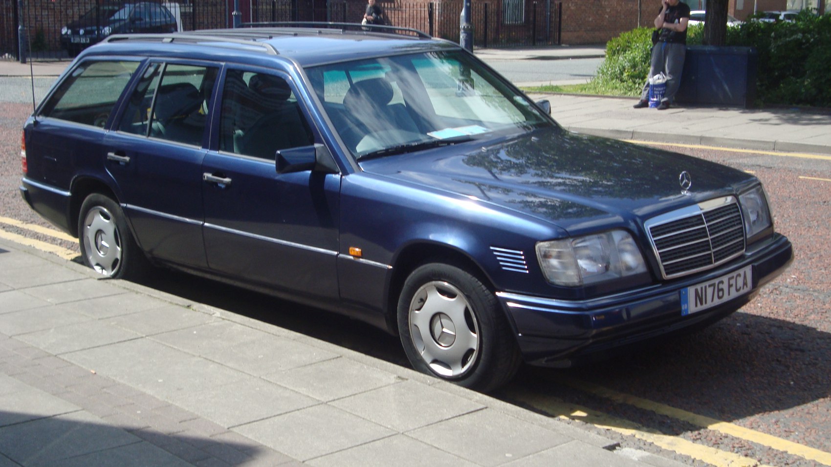 Rectangular front grille, alloy wheels, roof rails on classic station wagon