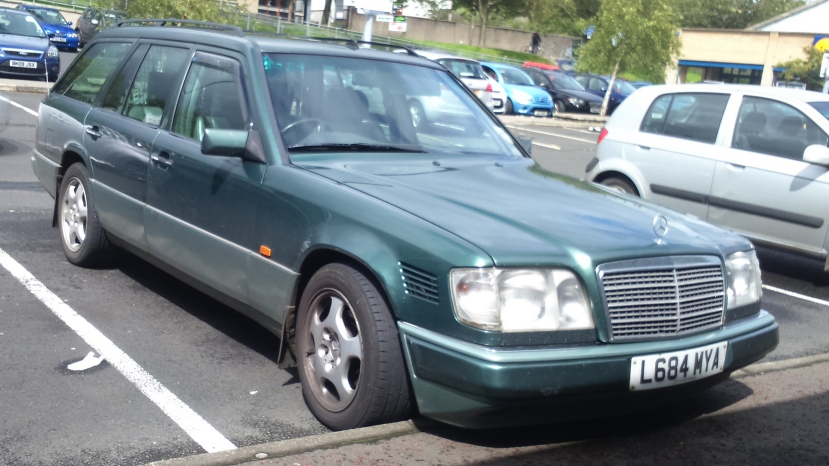 Green station wagon with prominent grille and rectangular headlights