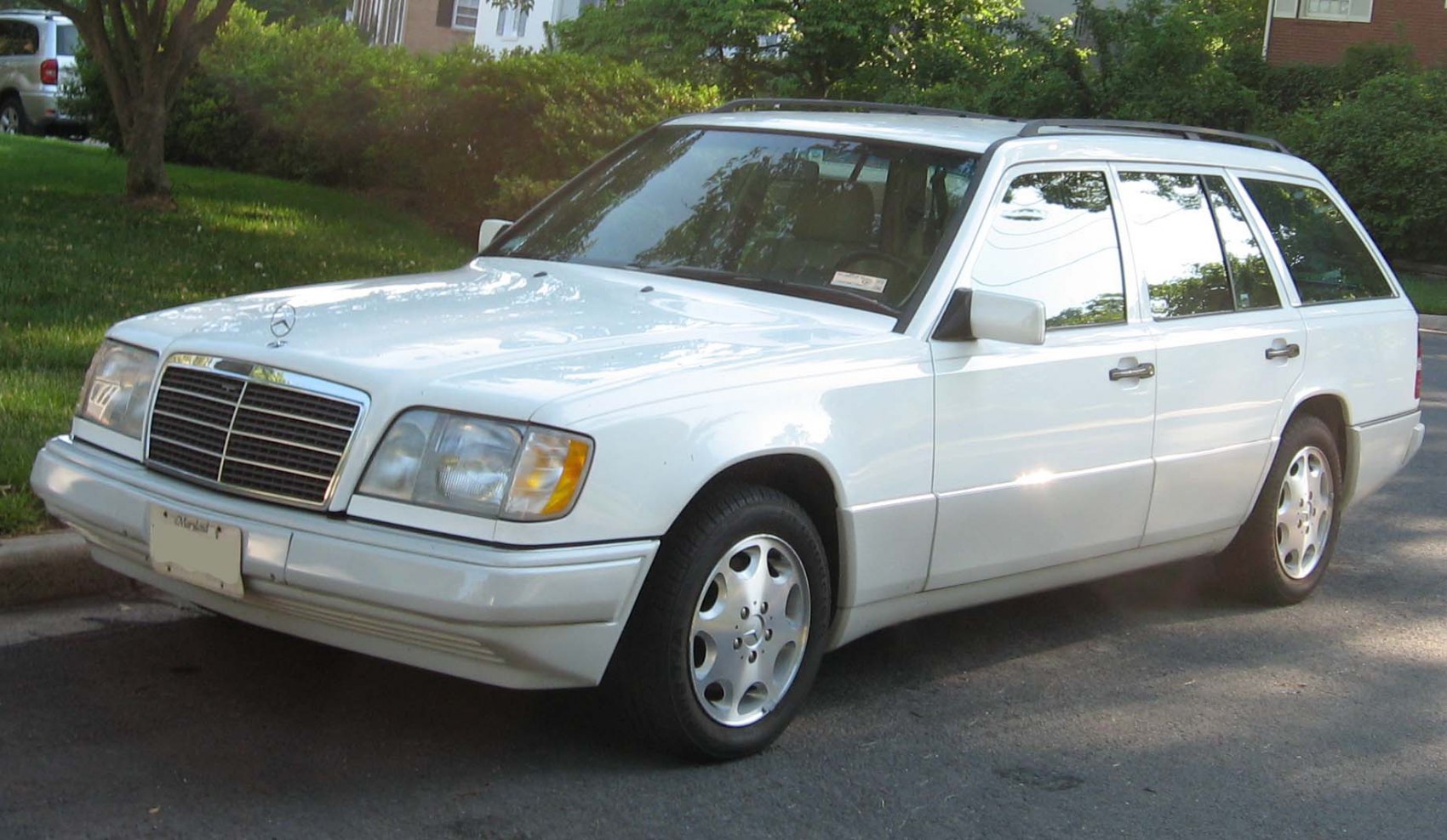 Station wagon with chrome grille, rectangular headlights, and roof rails