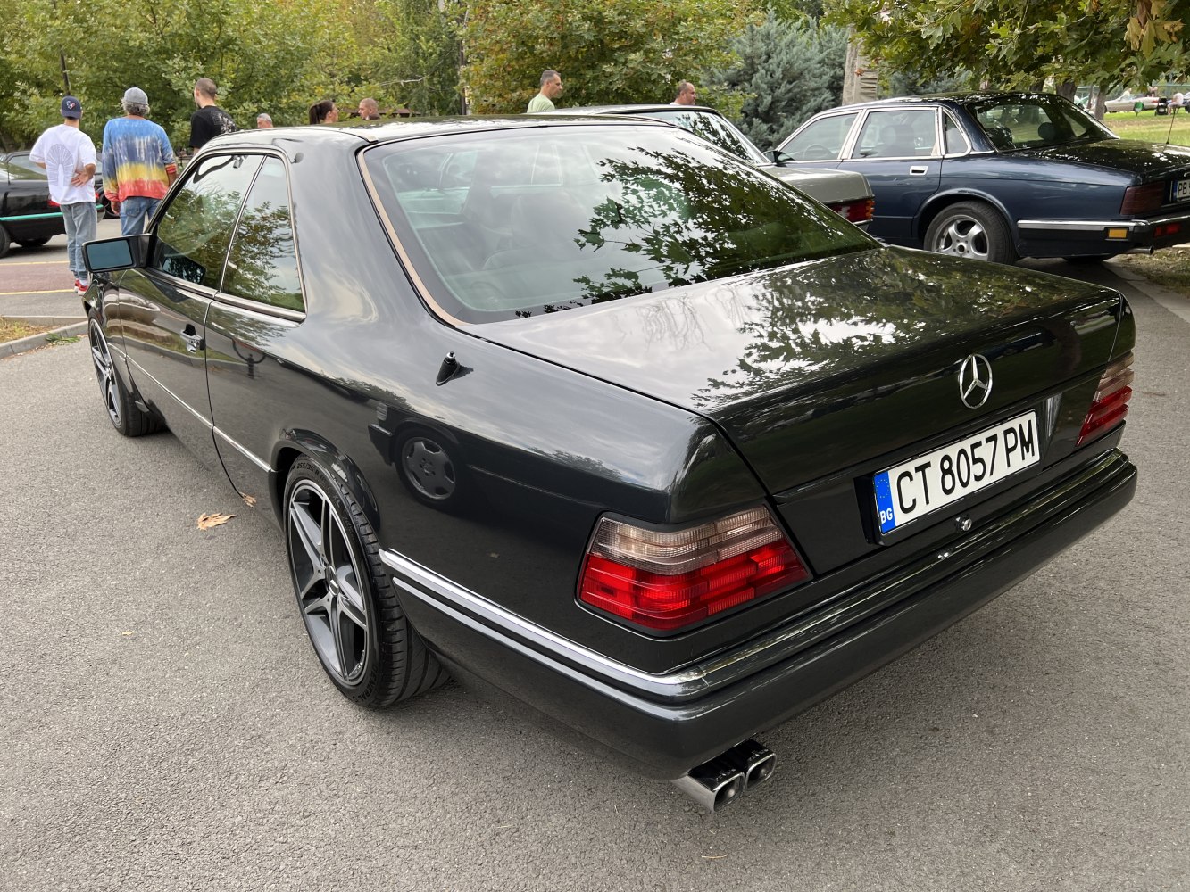 Rear view of coupe with distinctive taillights and modern alloy wheels