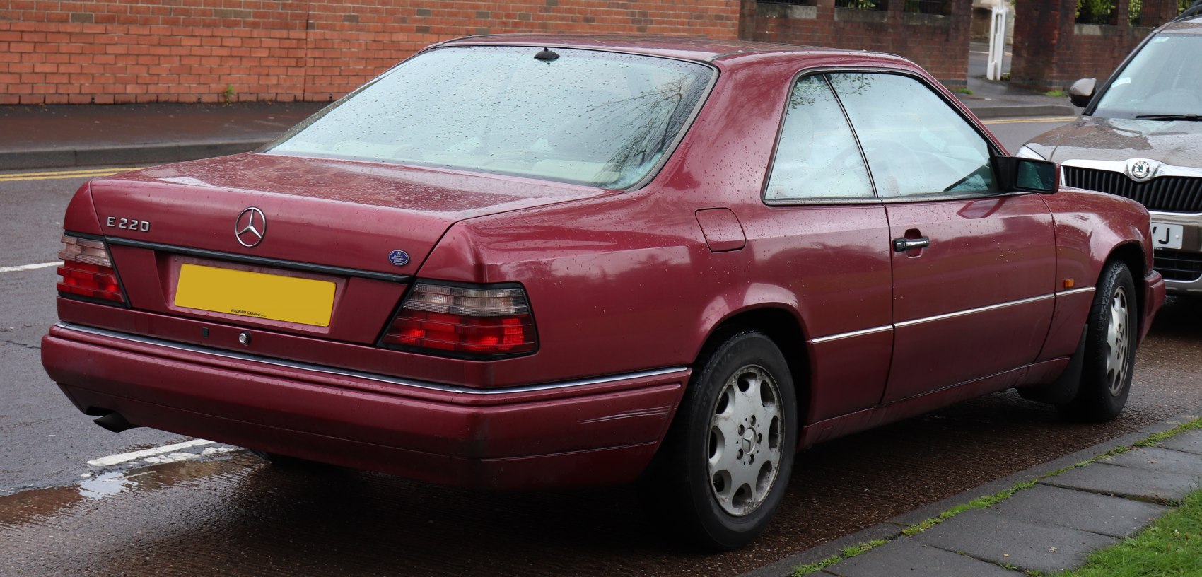 Rear and side view of a 1990s two-door coupe with distinctive taillights