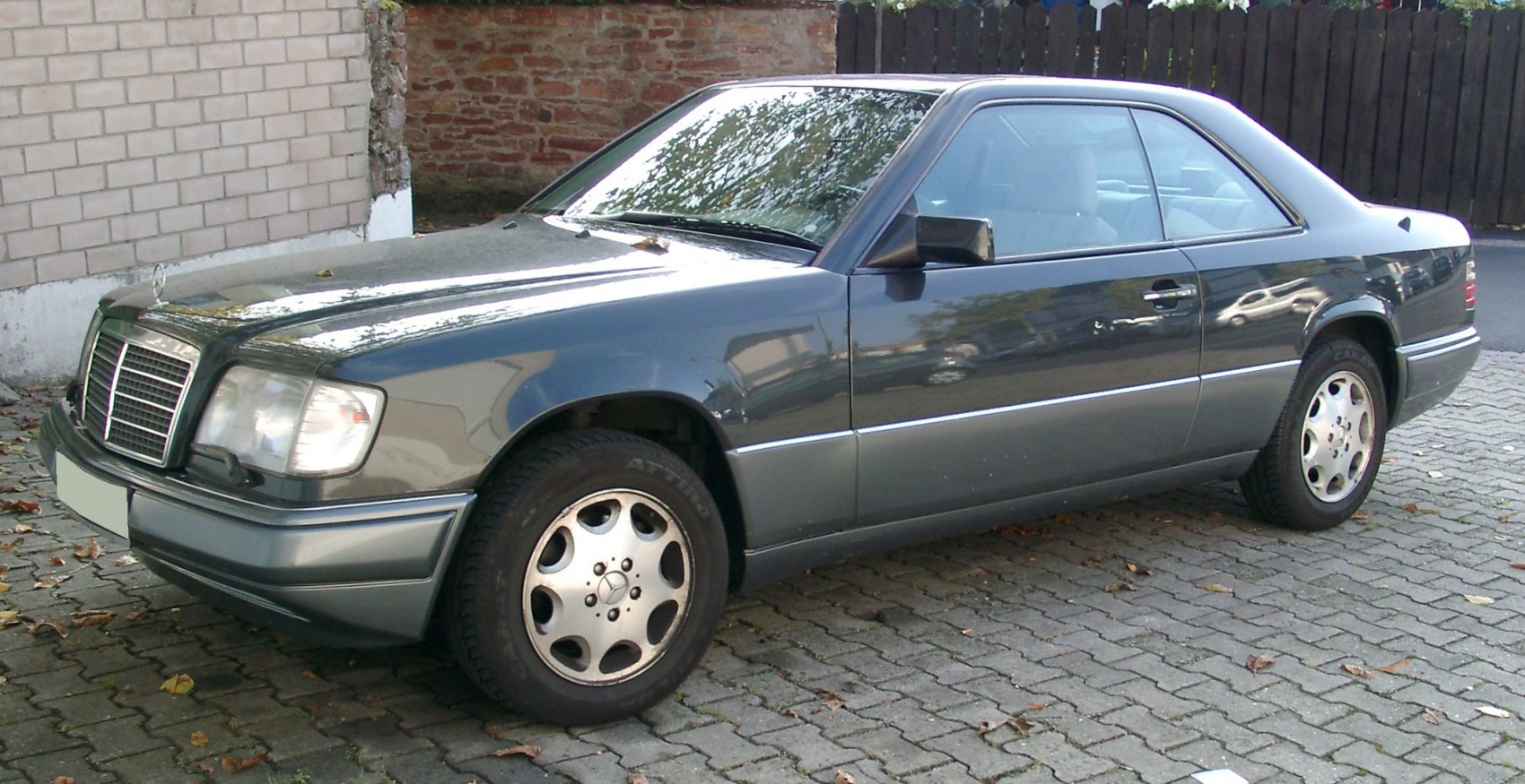 Classic coupe silhouette with distinctive front grille and alloy wheels