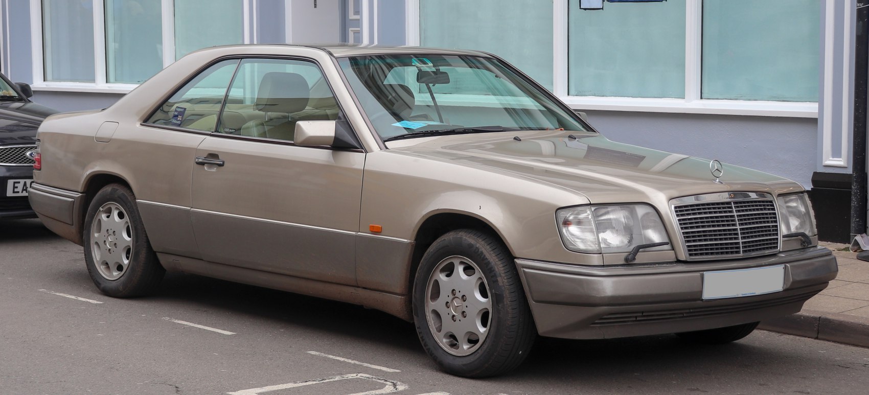 Classic coupe front-side with alloy wheels and windshield wipers