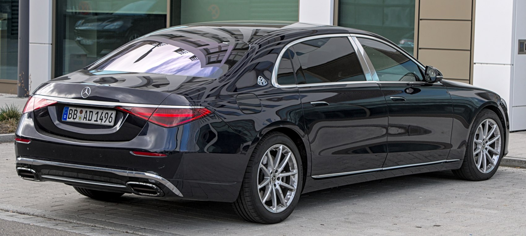 Luxury sedan rear view with sleek taillights and chrome trim