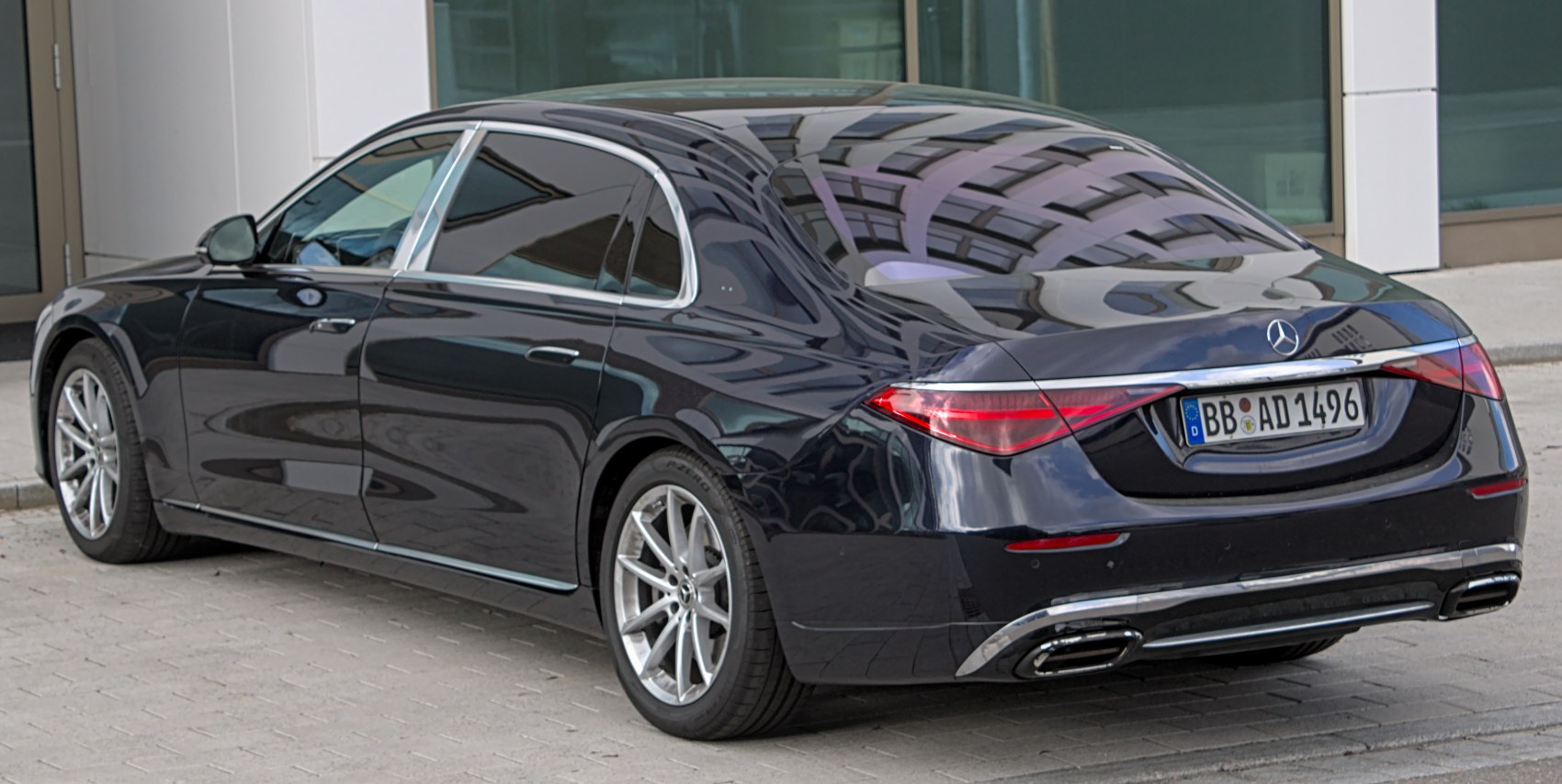 Rear view of luxury sedan with sleek taillights and chrome trim