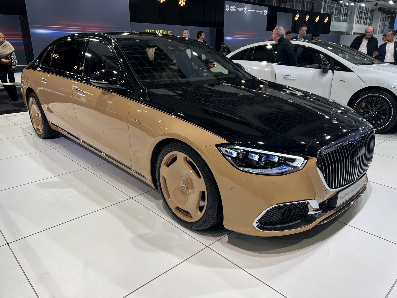 Two-tone luxury sedan with distinctive front grille and LED headlights