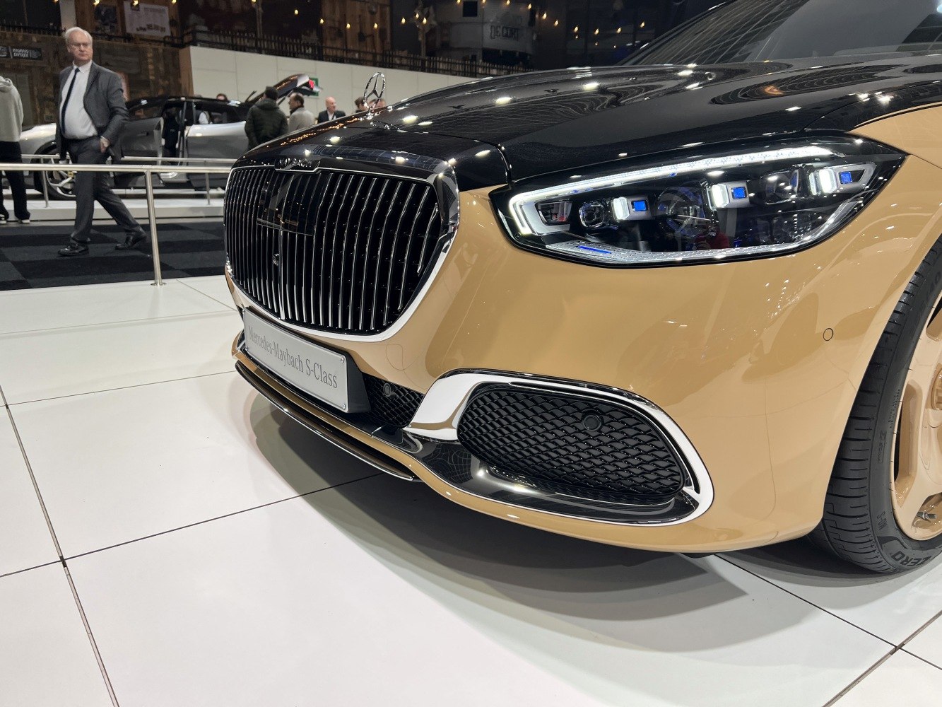 Close-up on chrome front grille and LED headlights of premium sedan