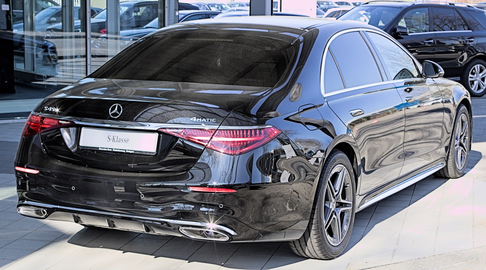 Luxury sedan rear with LED taillights and dual exhausts