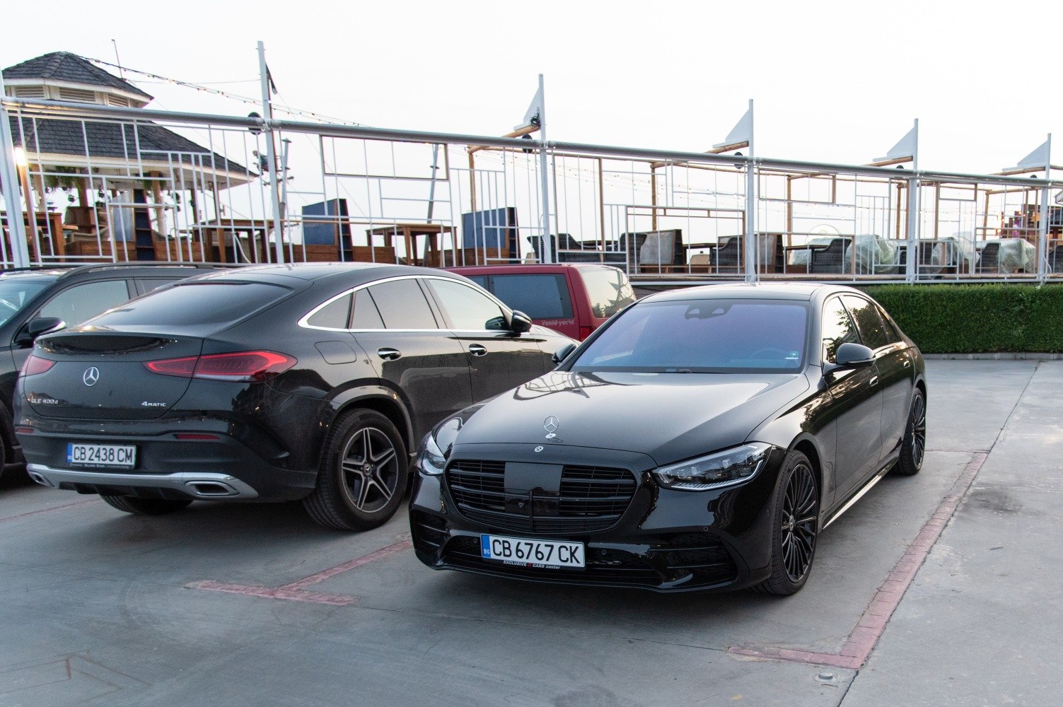 Black luxury sedan with sleek grille and LED headlights