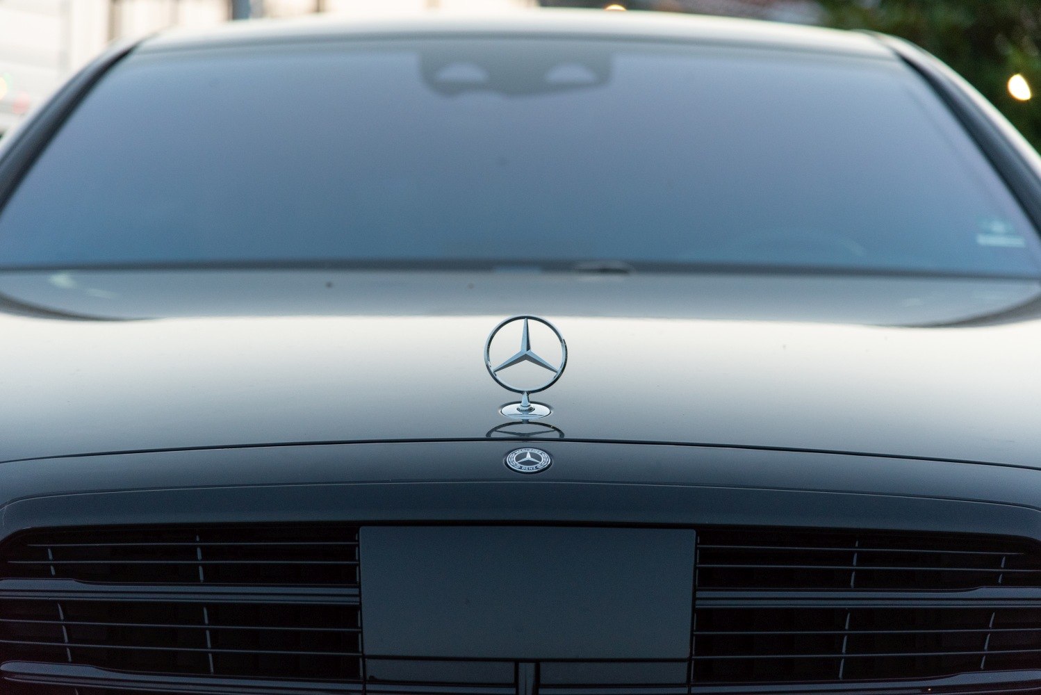Mercedes-Benz front emblem and grille close-up.