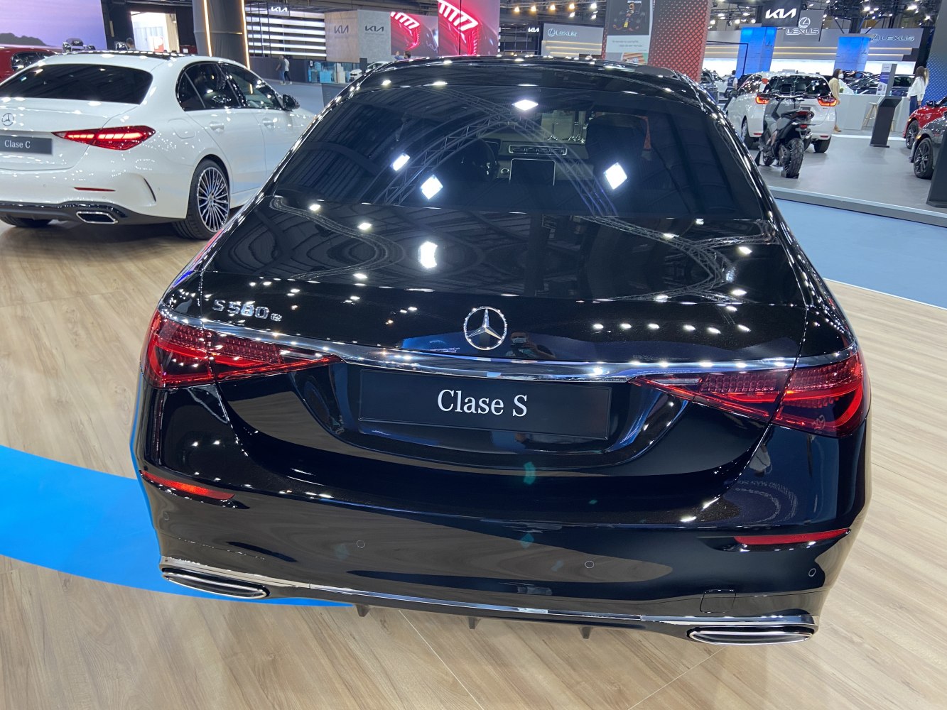 Rear view of a luxury sedan with distinctive taillights and dual exhausts