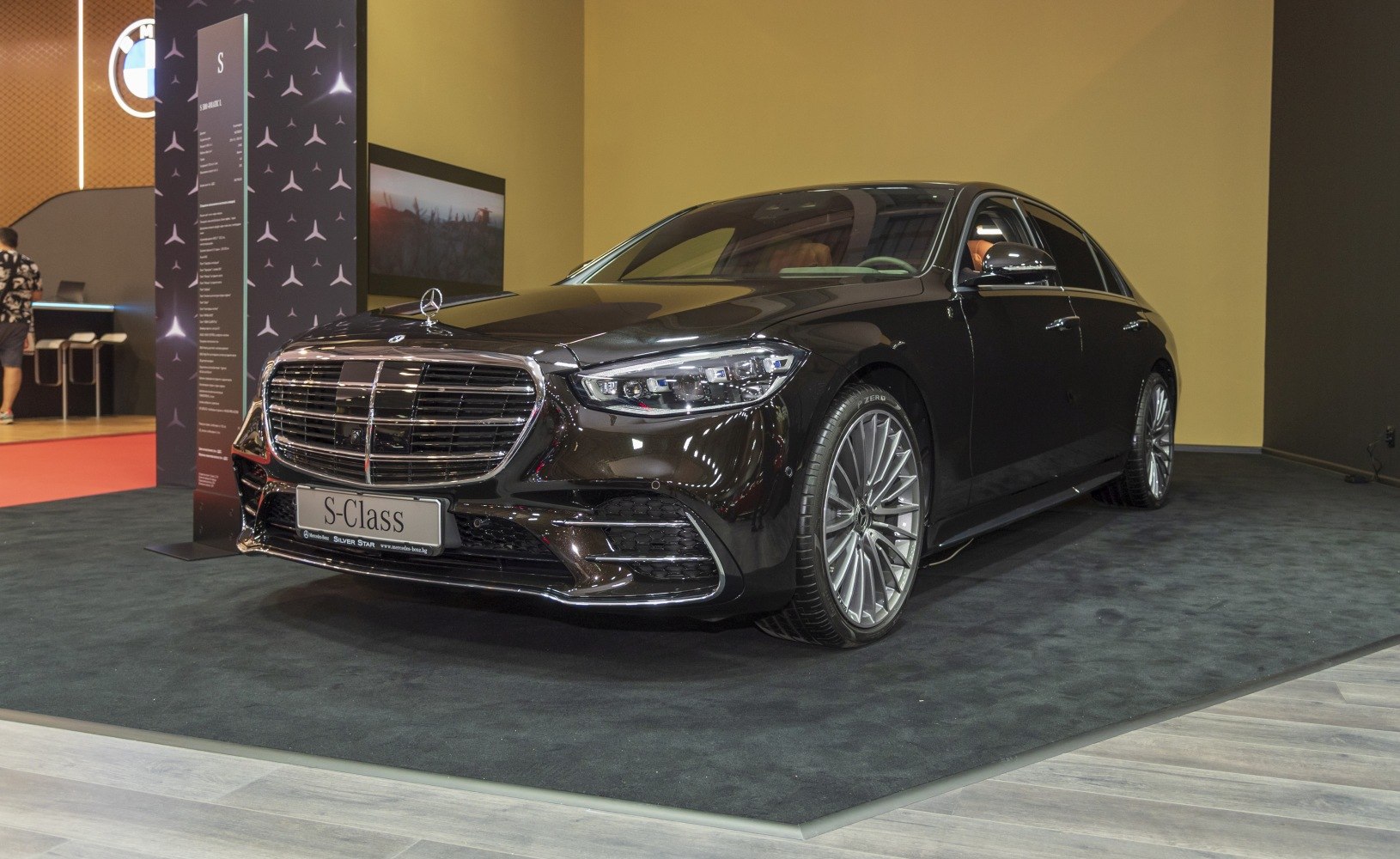 Luxury sedan front with signature grille and LED headlights