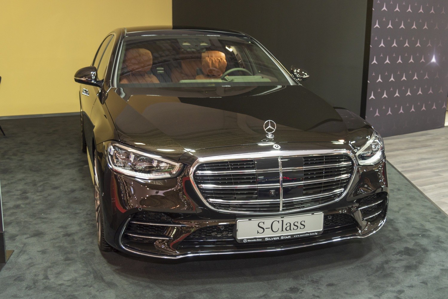 Luxury sedan front with prominent grille and LED headlights