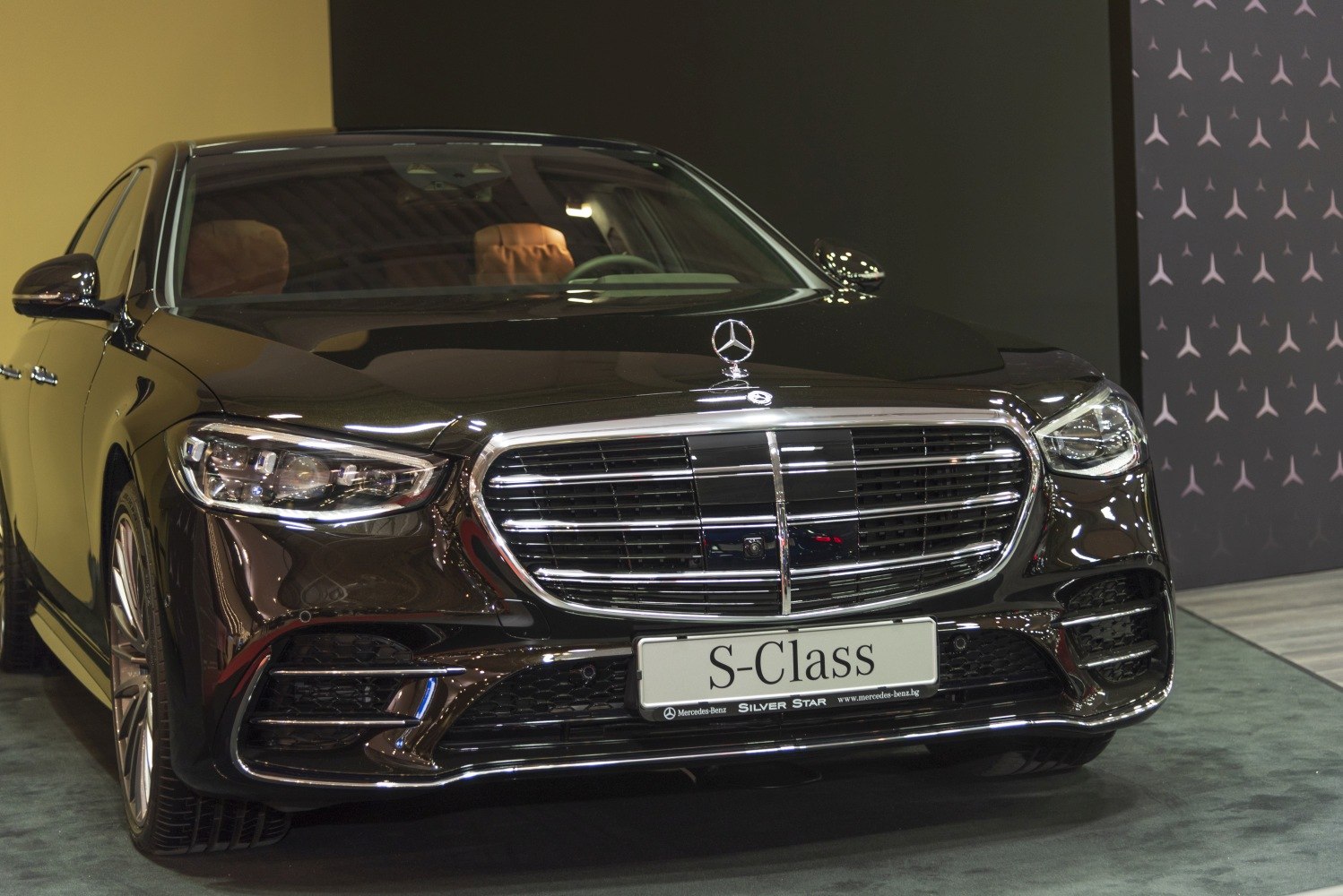 Luxury car front grille with distinct chrome detailing and LED headlight design