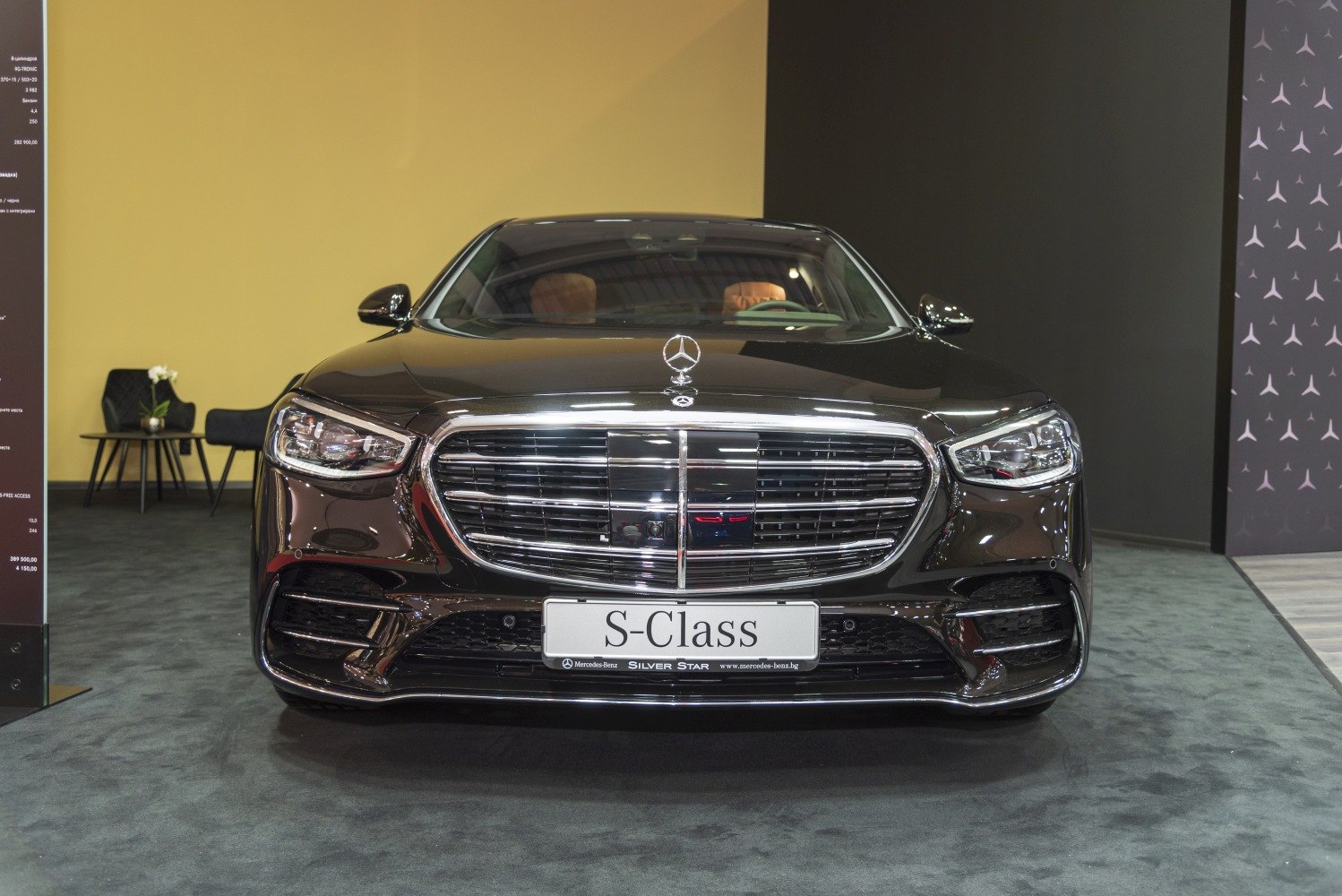 Luxury sedan front with large chrome grille and LED headlights