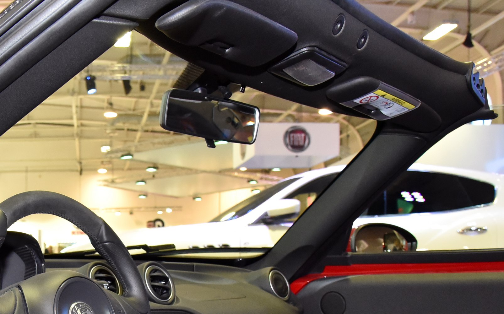 Interior roof with rearview mirror and steering wheel in convertible car