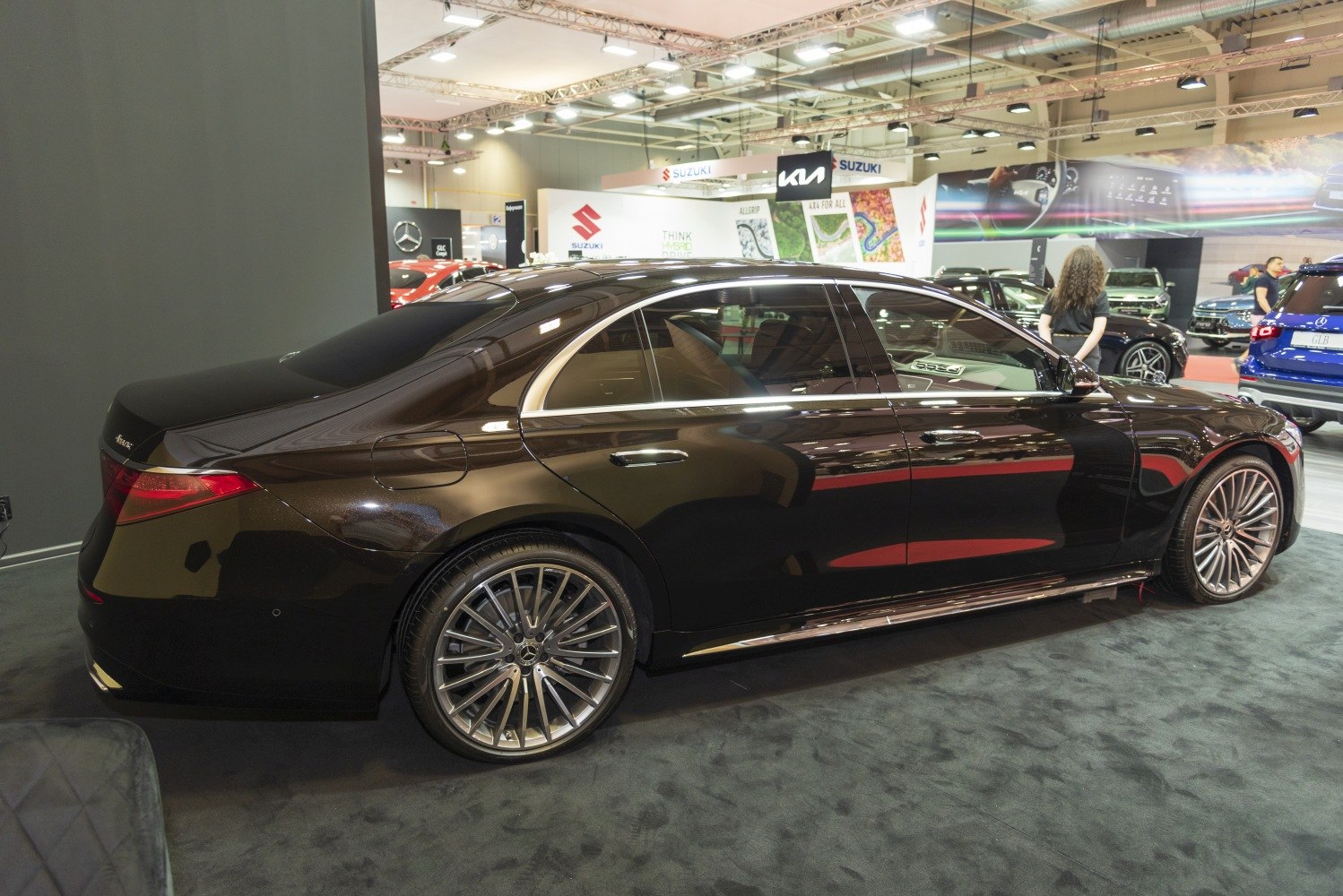 Luxury modern sedan with multi-spoke alloy wheels and black paint