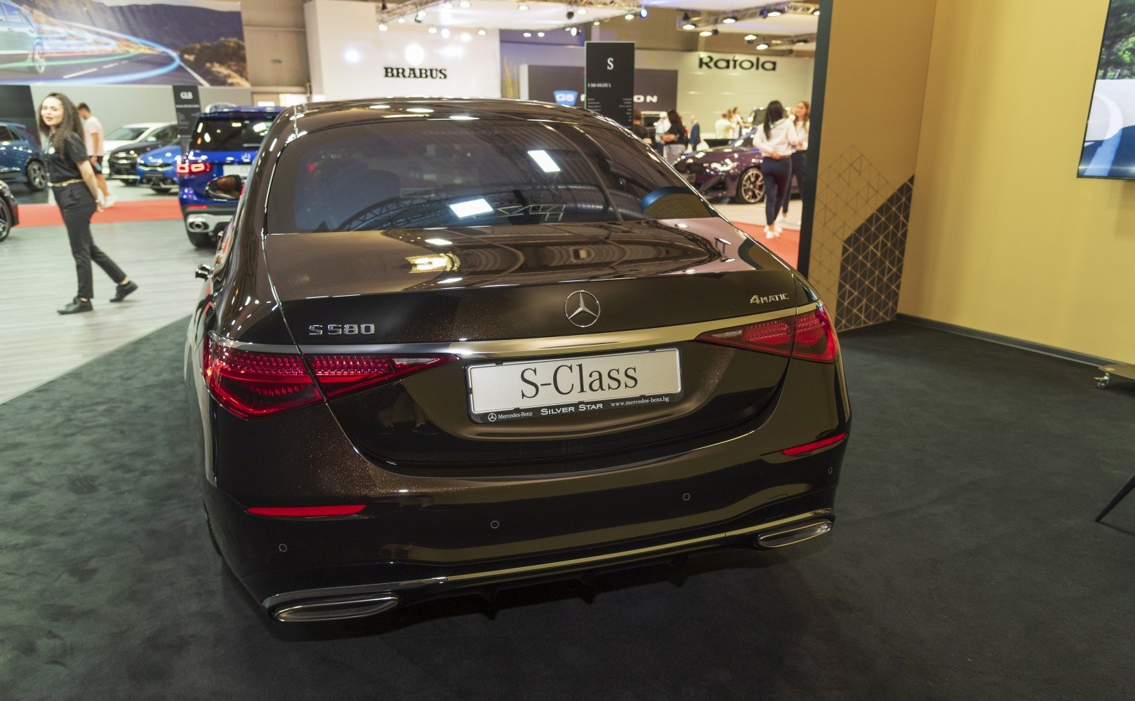 Rear view with distinctive taillights and dual exhausts of a luxury sedan