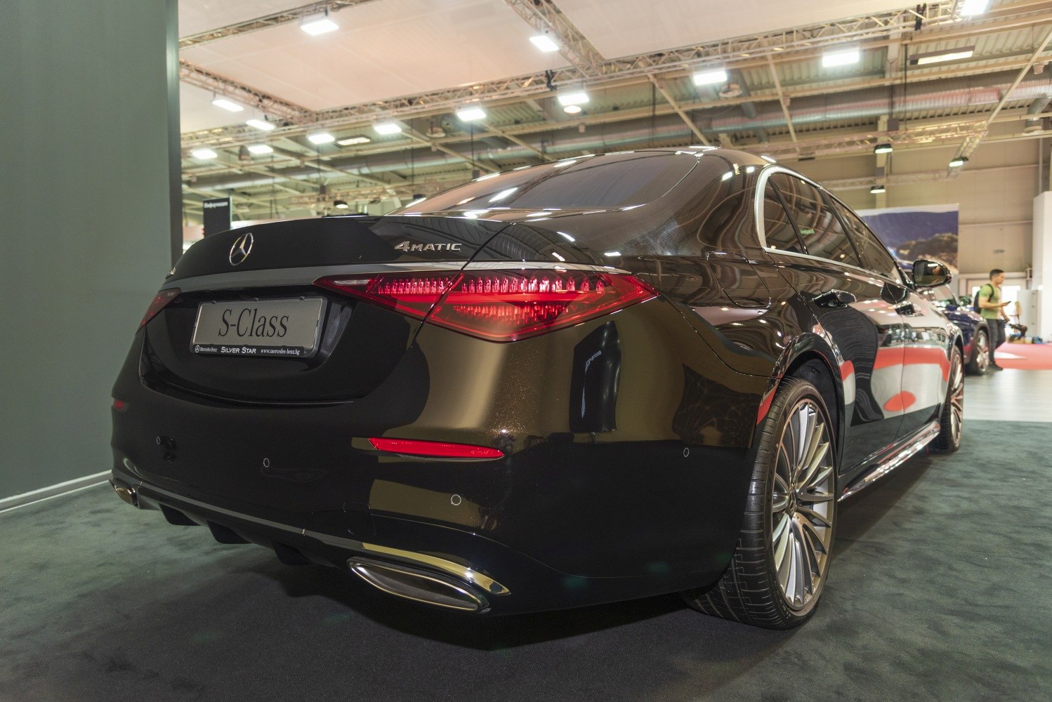 Rear view showing taillights and 4MATIC badge on luxury sedan