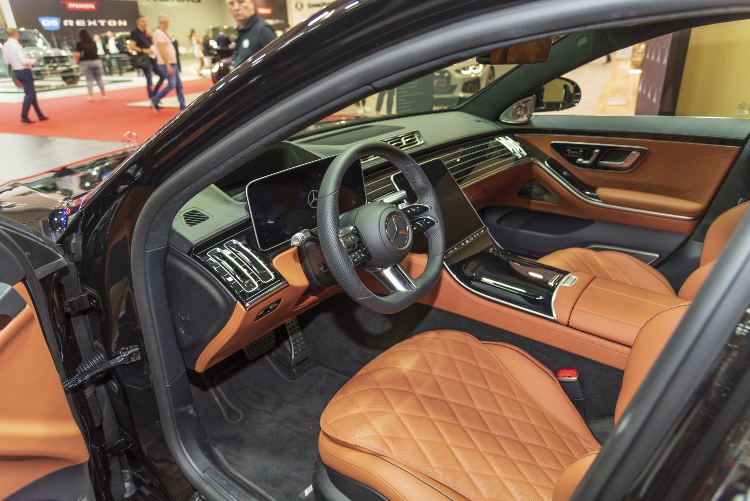 Luxurious brown quilted leather seats and digital dashboard with touchscreen display