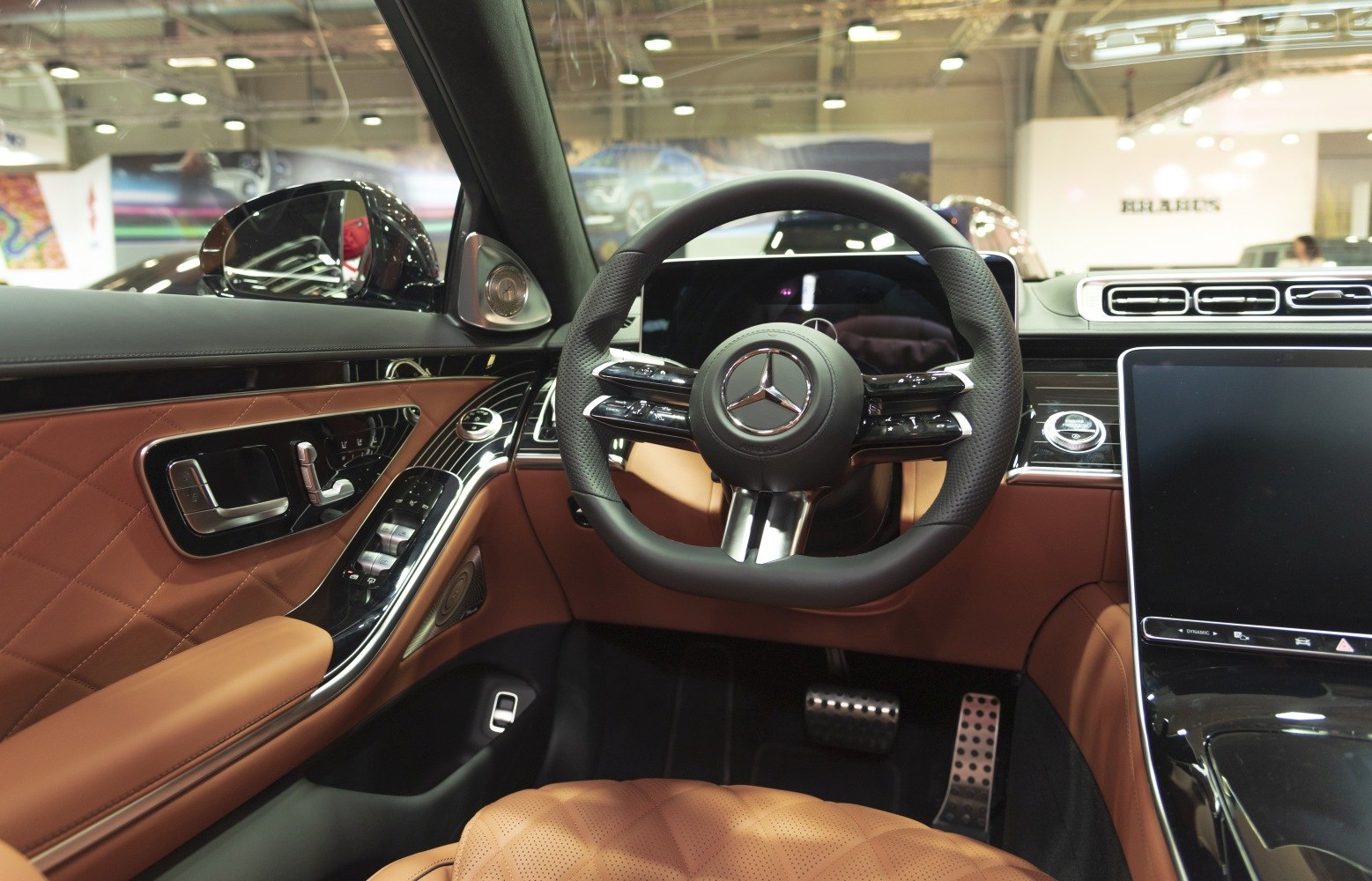Luxury steering wheel and dashboard with brown leather upholstery