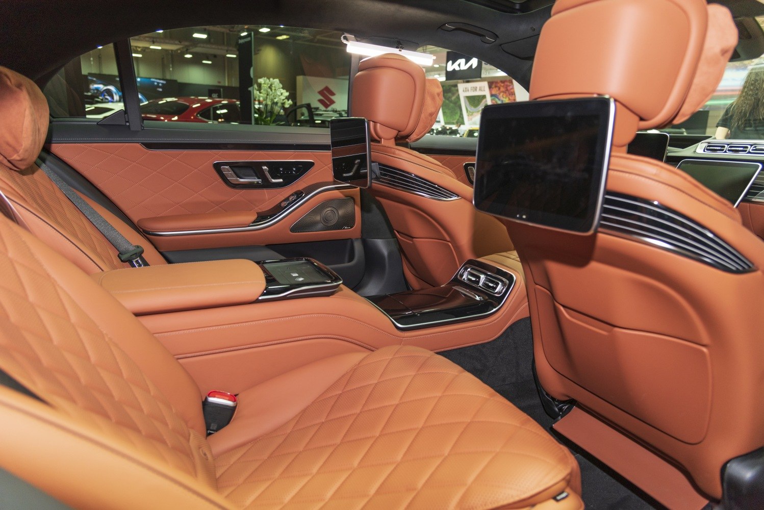 Luxury tan leather quilted rear seats with digital entertainment screens