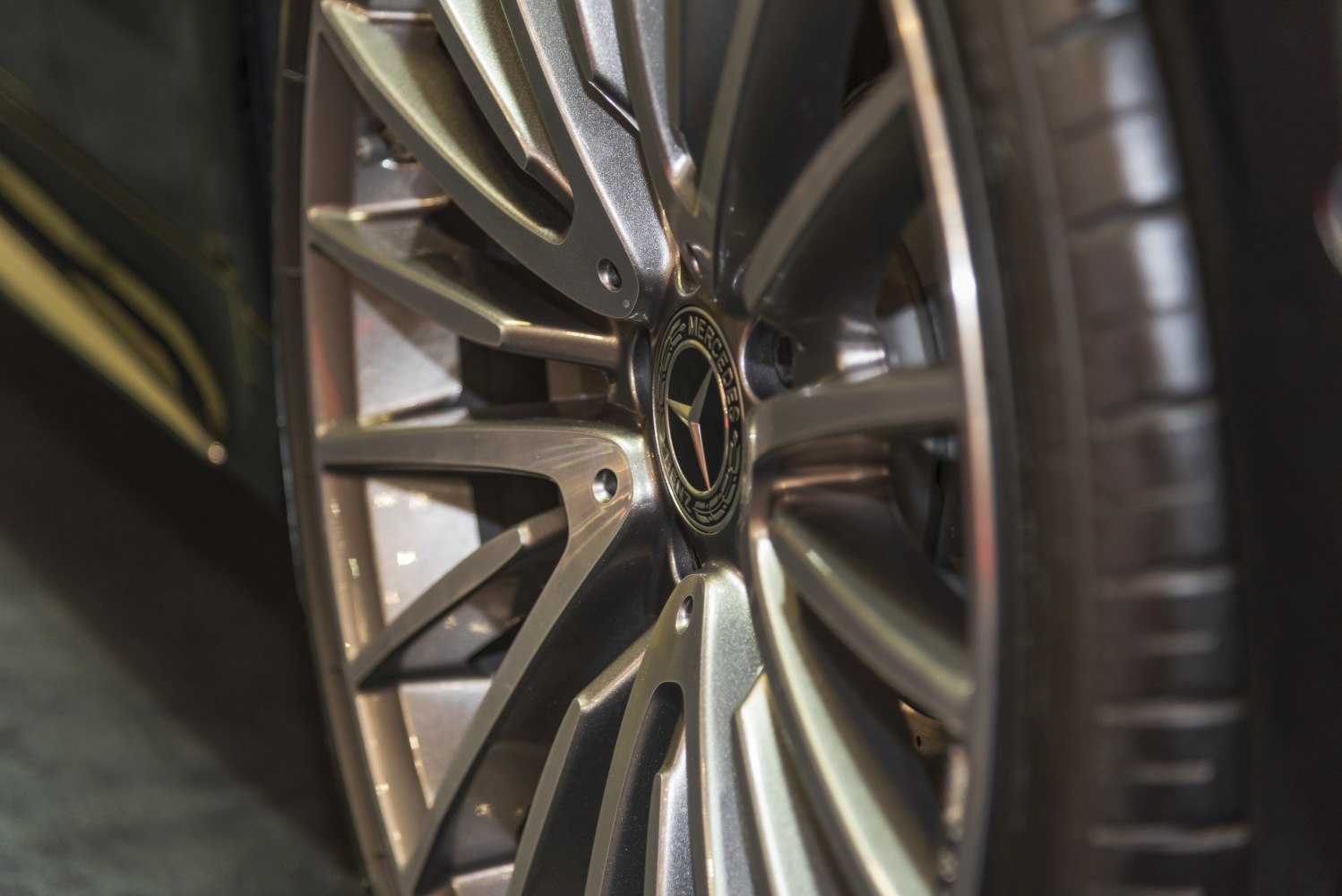 Close-up of detailed alloy wheel rim and tire tread