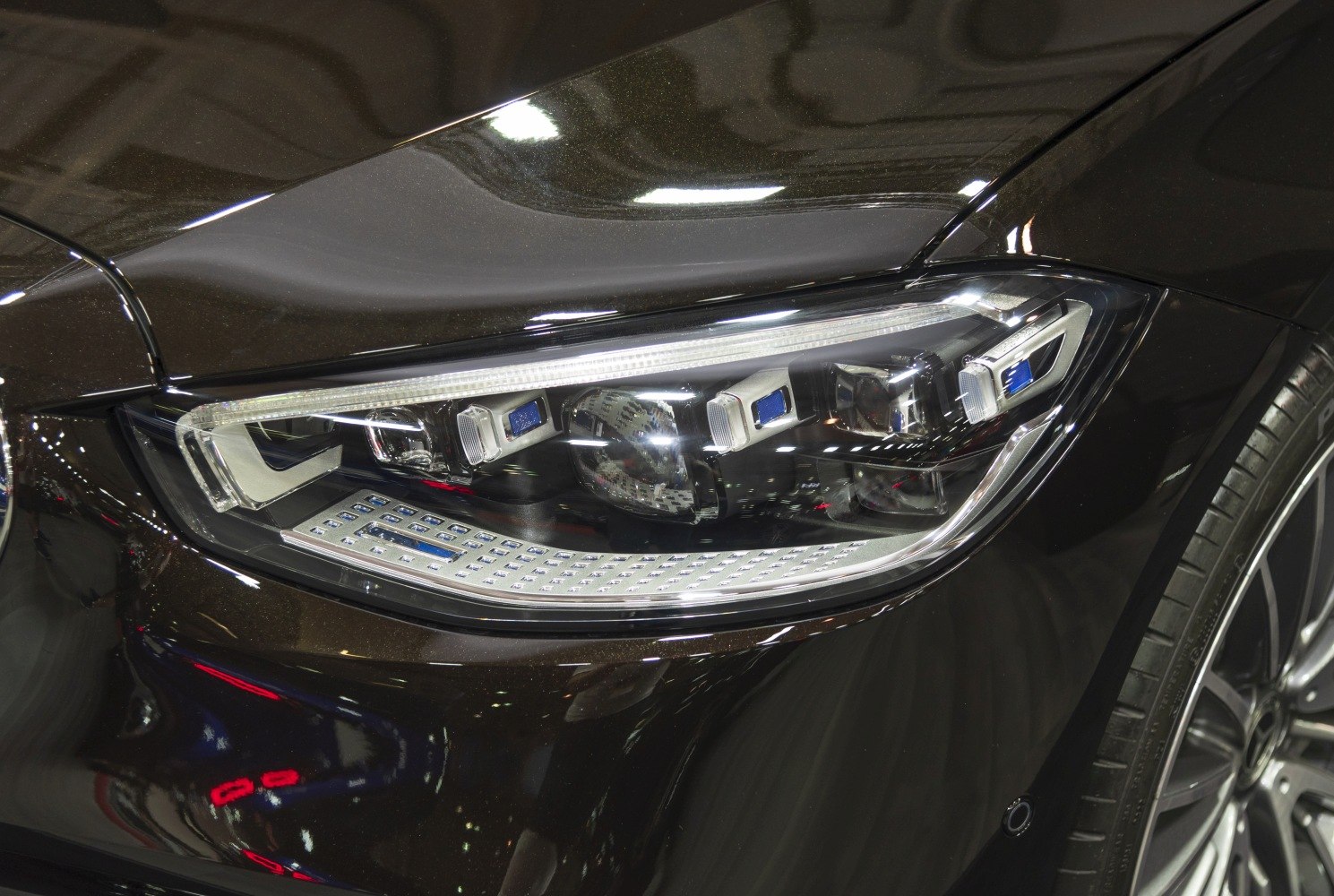 Detailed advanced LED headlight close-up with sleek design and reflective elements