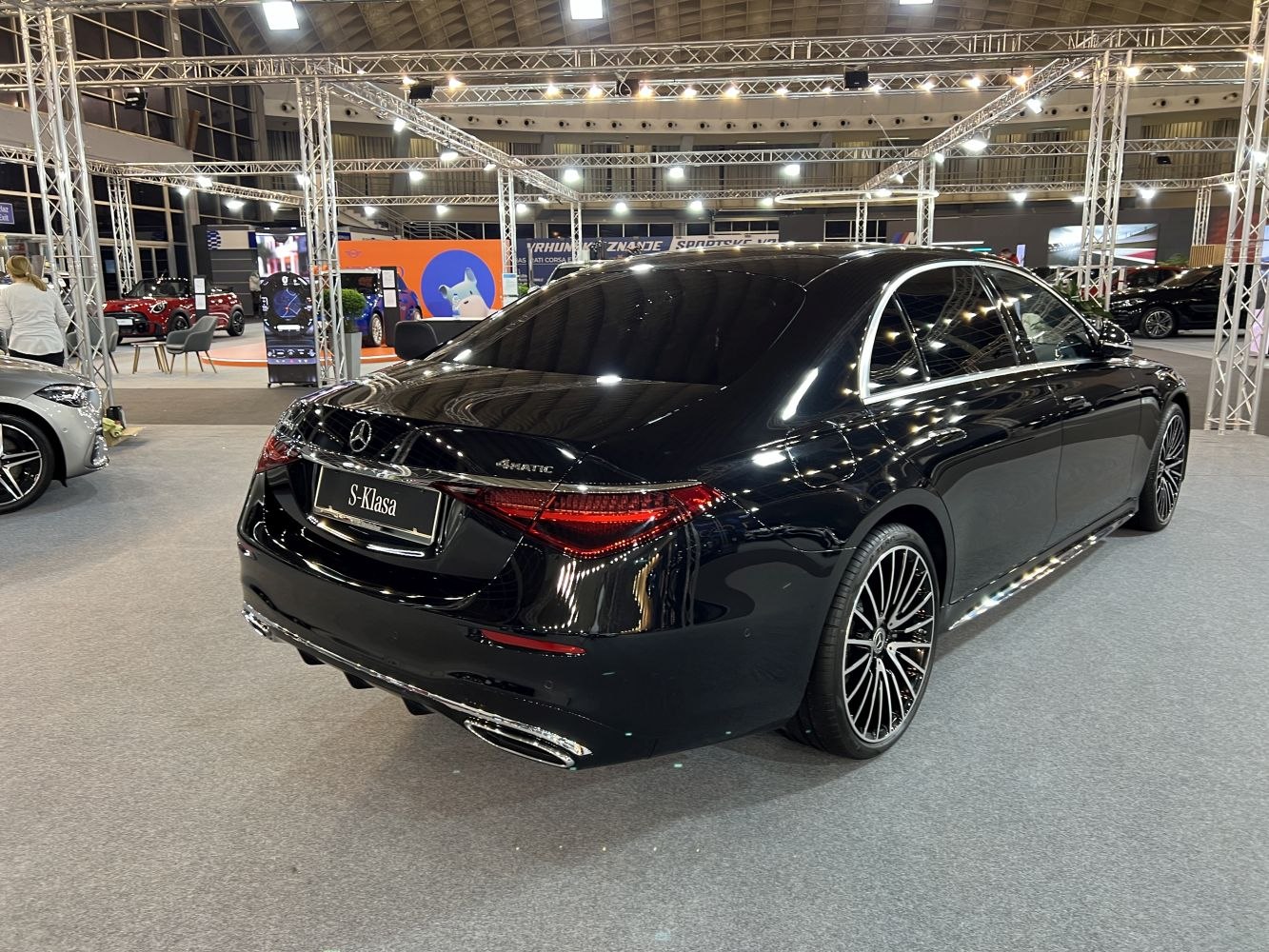 Luxury sedan rear with 4MATIC badge and multi-spoke alloy wheels