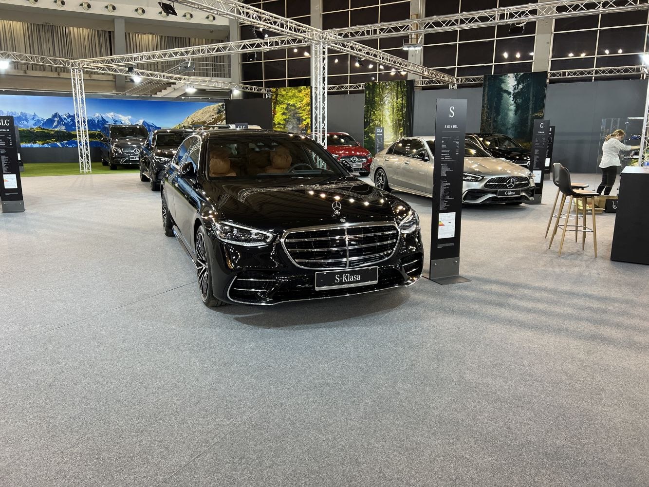 Front view with grille and LED headlights of luxury sedan in showroom