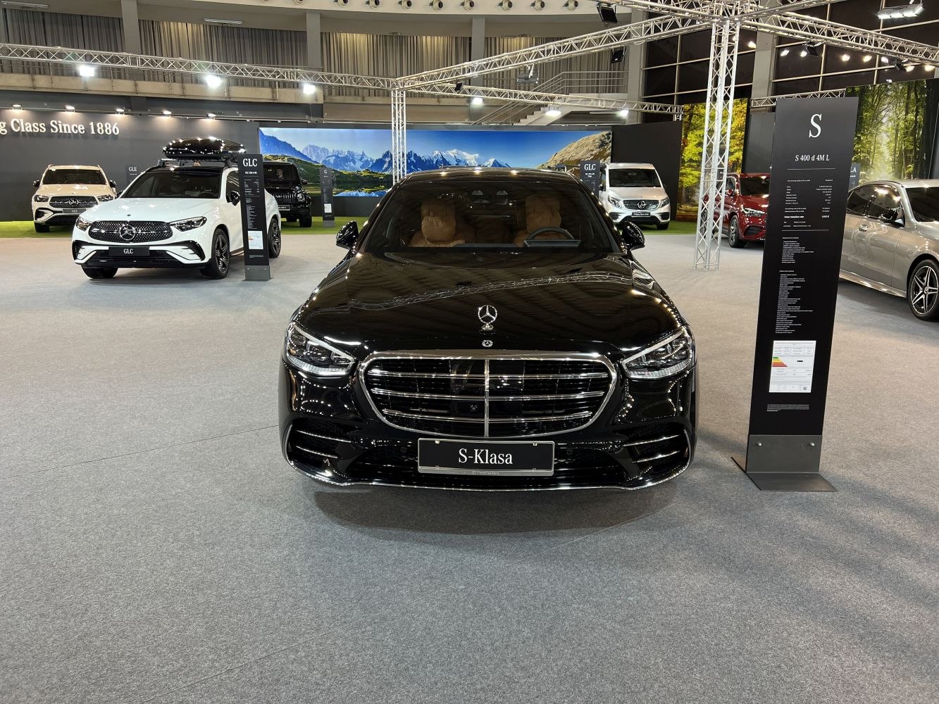 Front grille, LED headlights, panoramic windshield, luxury sedan interior