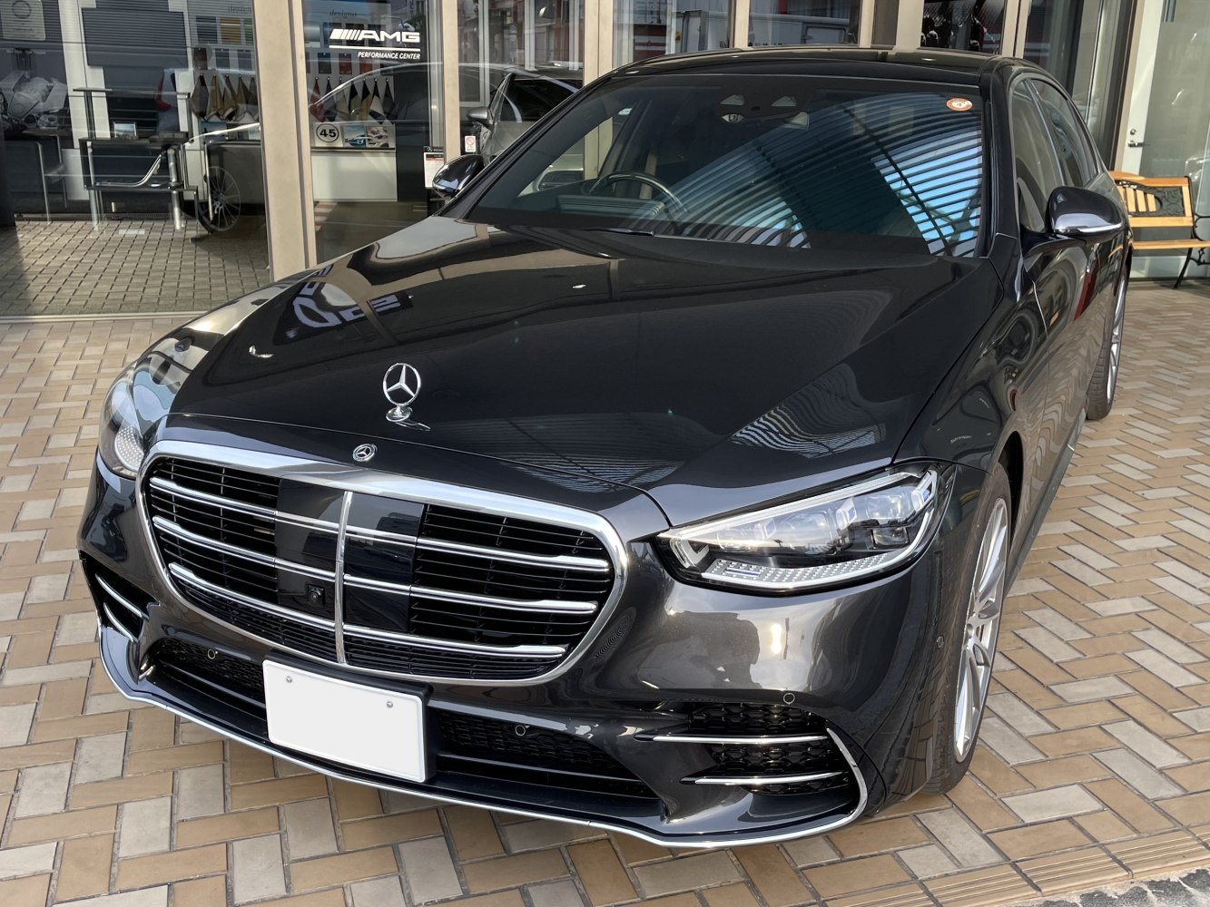 Front grille and LED headlights of a luxury sedan with sleek aerodynamic design