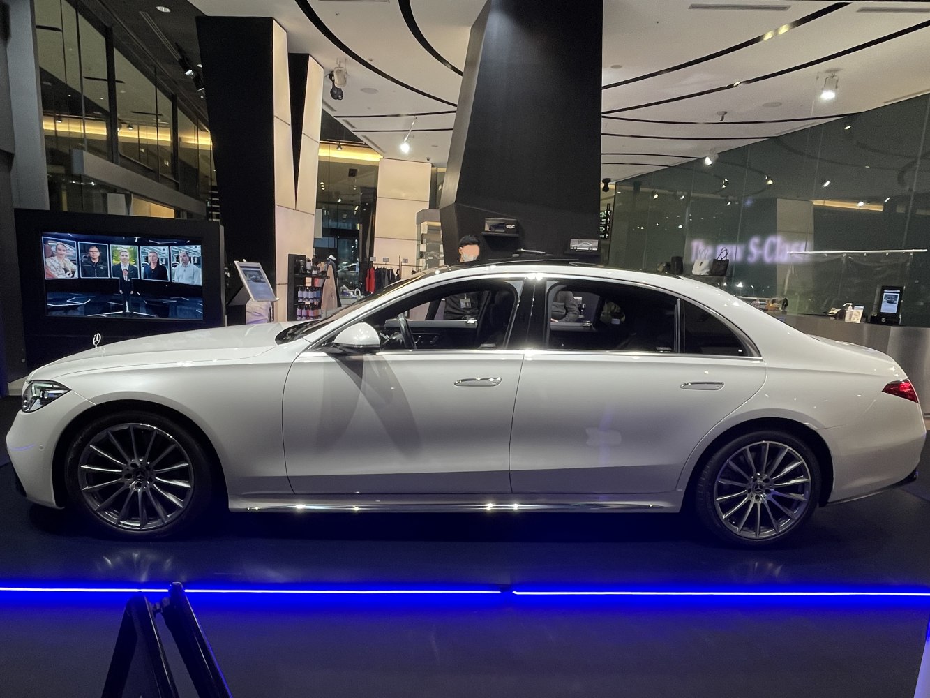 Side profile of a luxury sedan with extended wheelbase and elegant design.
